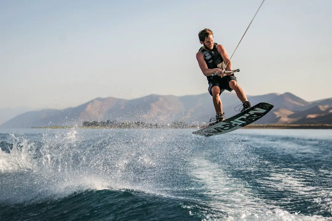 Wakeboarding by Hydrofoiling a man water skiing