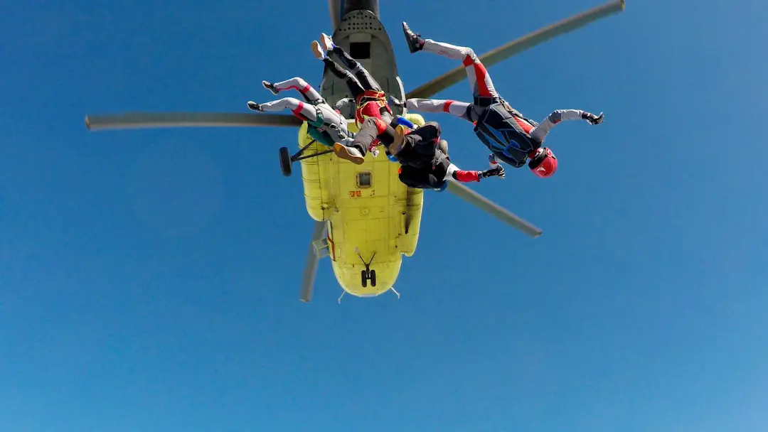 three skydiving people
