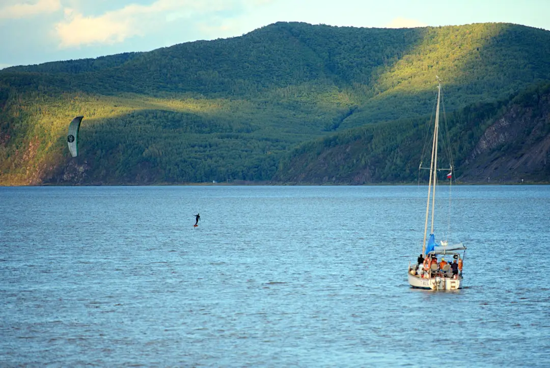 A sailboat in the middle of a large body of water